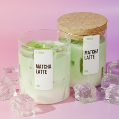 A 15 oz candle in a clear glass jar: creamy matcha-green soy wax base topped with translucent gel wax "ice cubes," mimicking a chilled matcha latte with a fresh, herbal glow.
